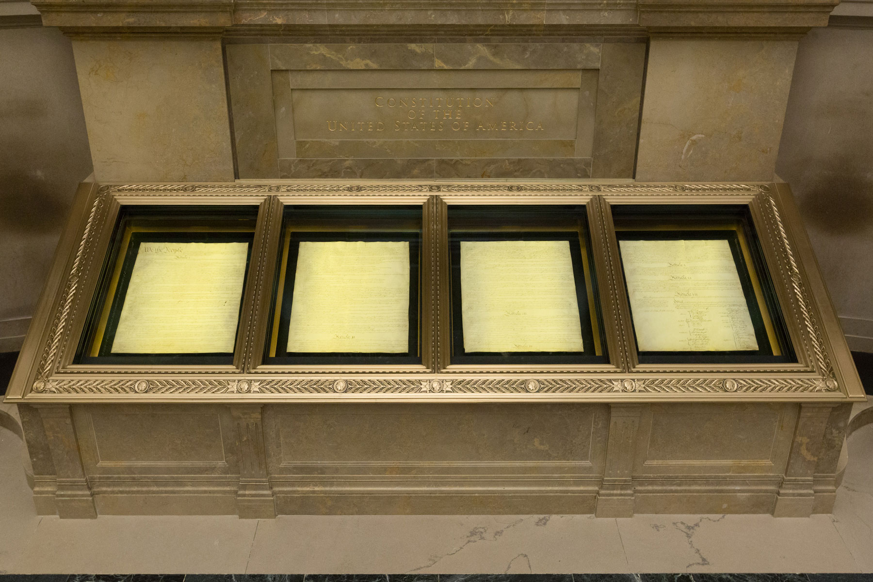 The four pages of the US Constitution in their encasements